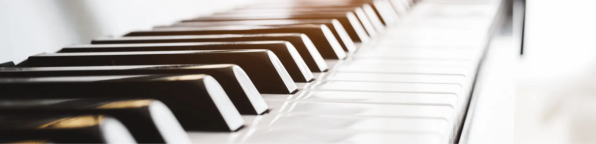 Classic piano key with musician hands playing